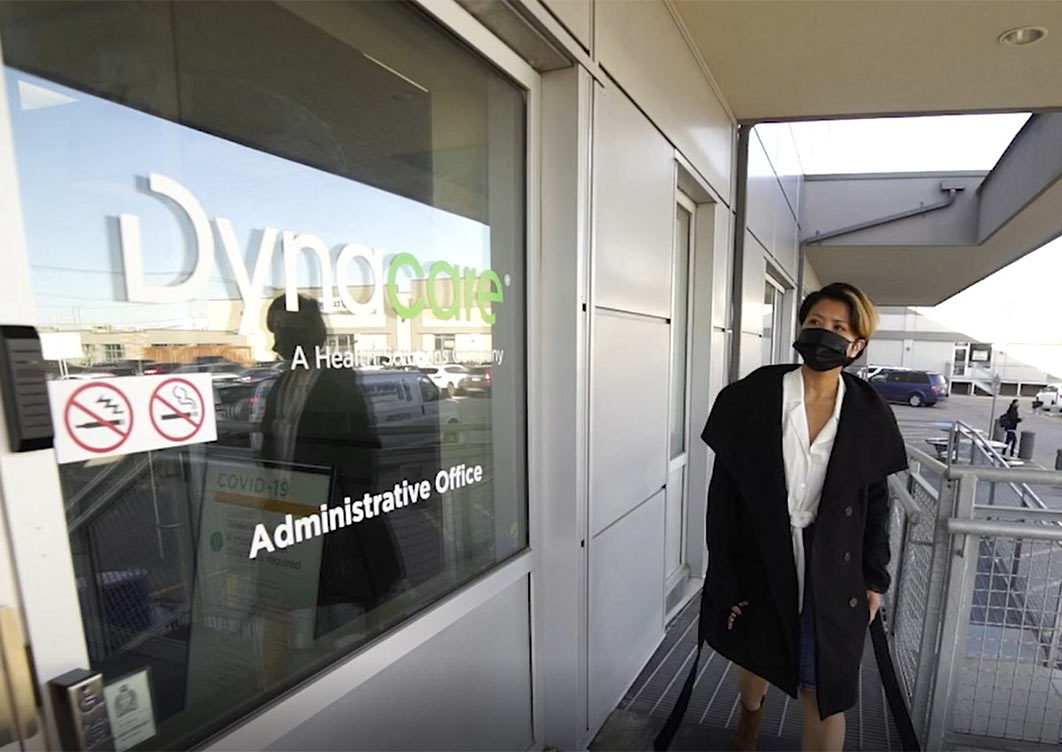 Person approaching the front door of Dynacare's administrative office.