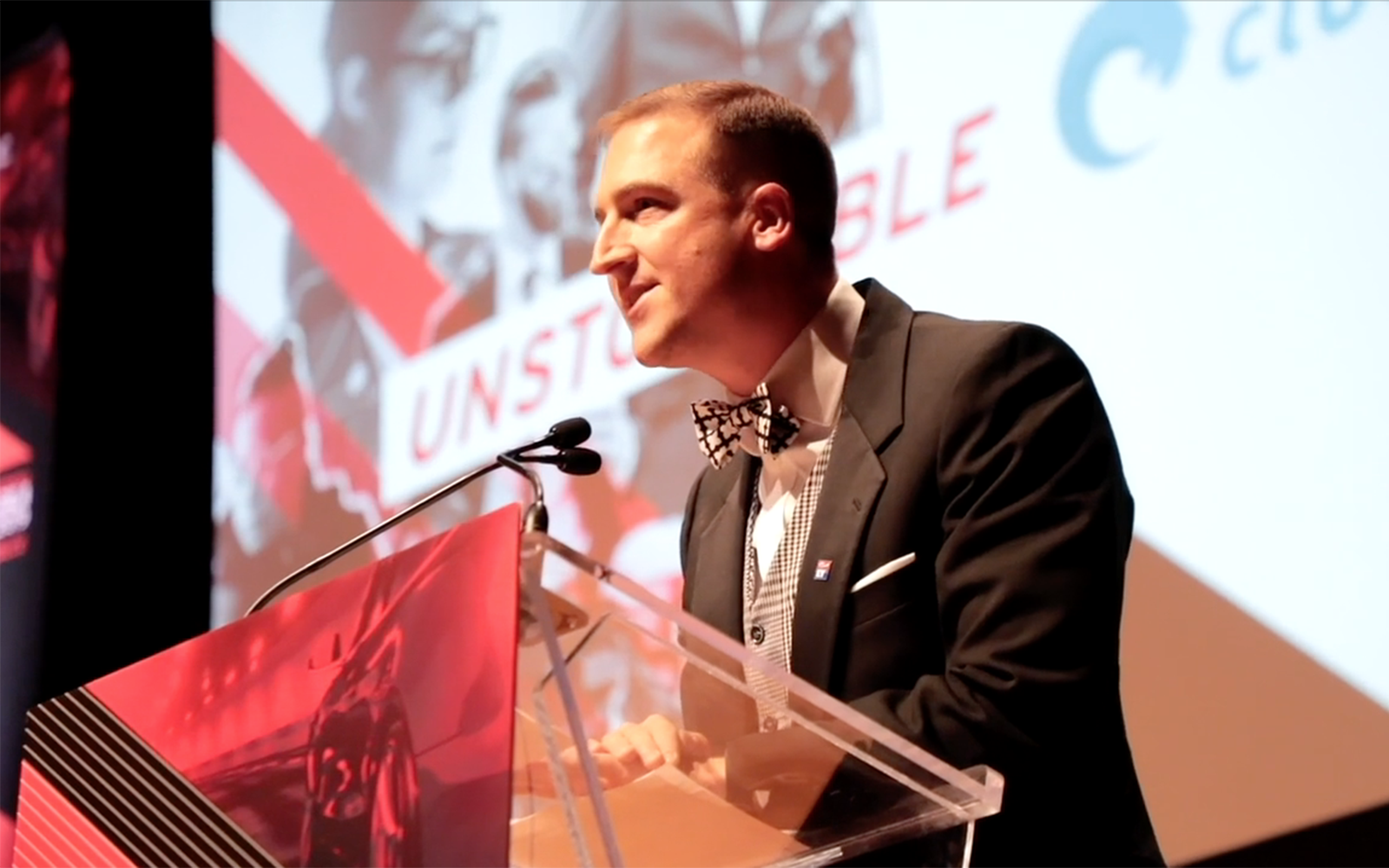 Photo of a person speaking from a podium at a CGLCC event.