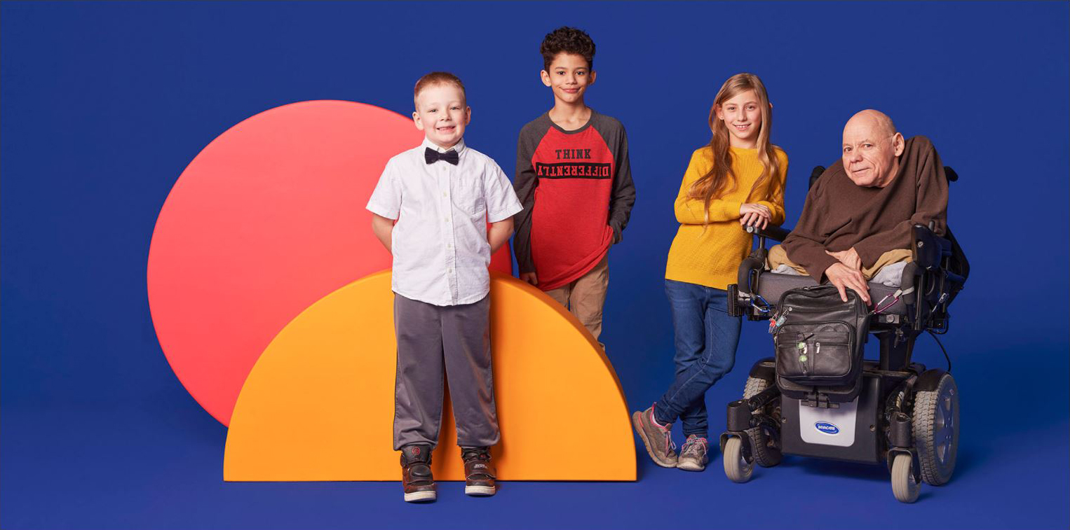 Still of a father and his children in front of bright circles on a purple background.