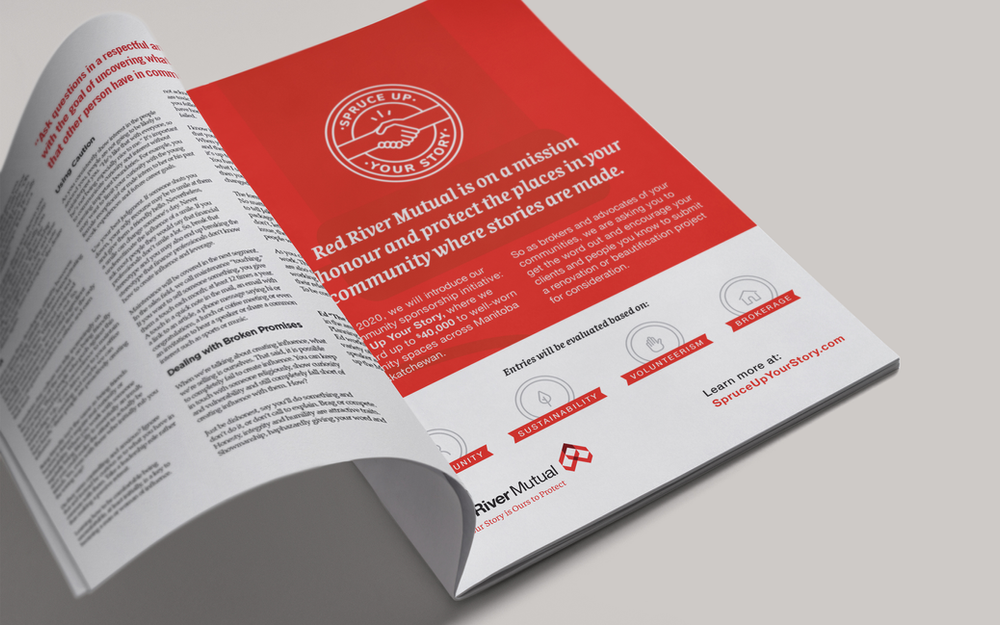 Two people from Manitoba Abilities sitting in front of a computer. 