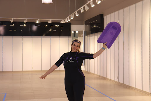 Aqua Essence instructor posing with a flutter board