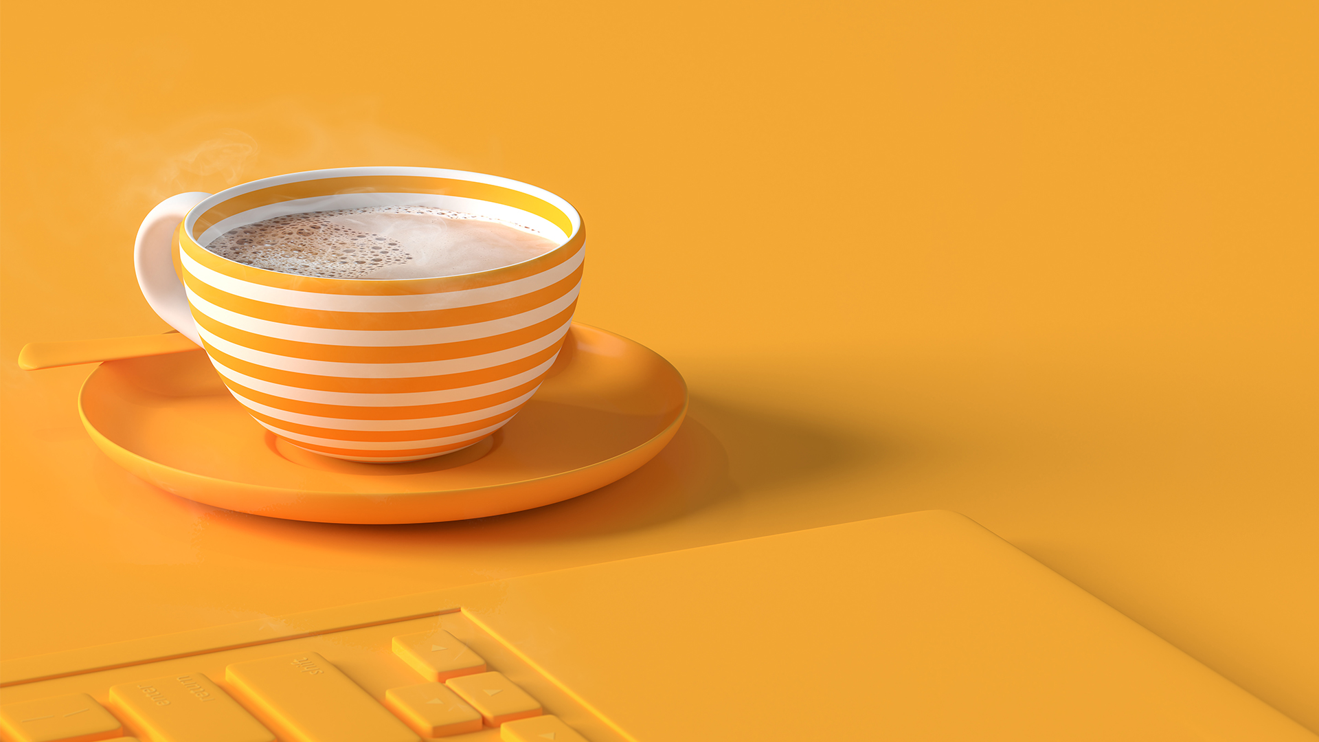 Yellow keyboard and white and yellow striped mug on saucer with steaming coffee
