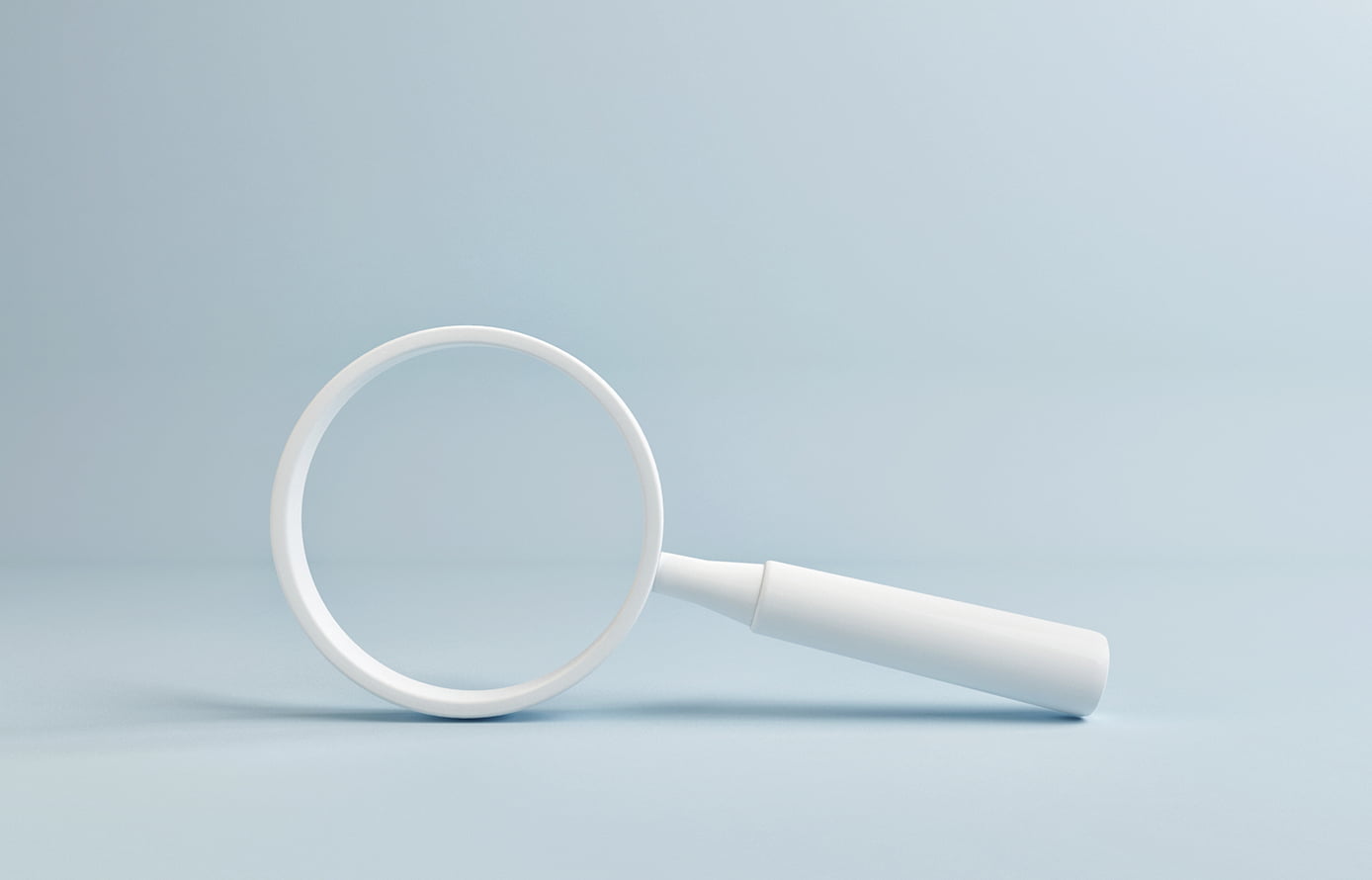 White magnifying glass on blue background