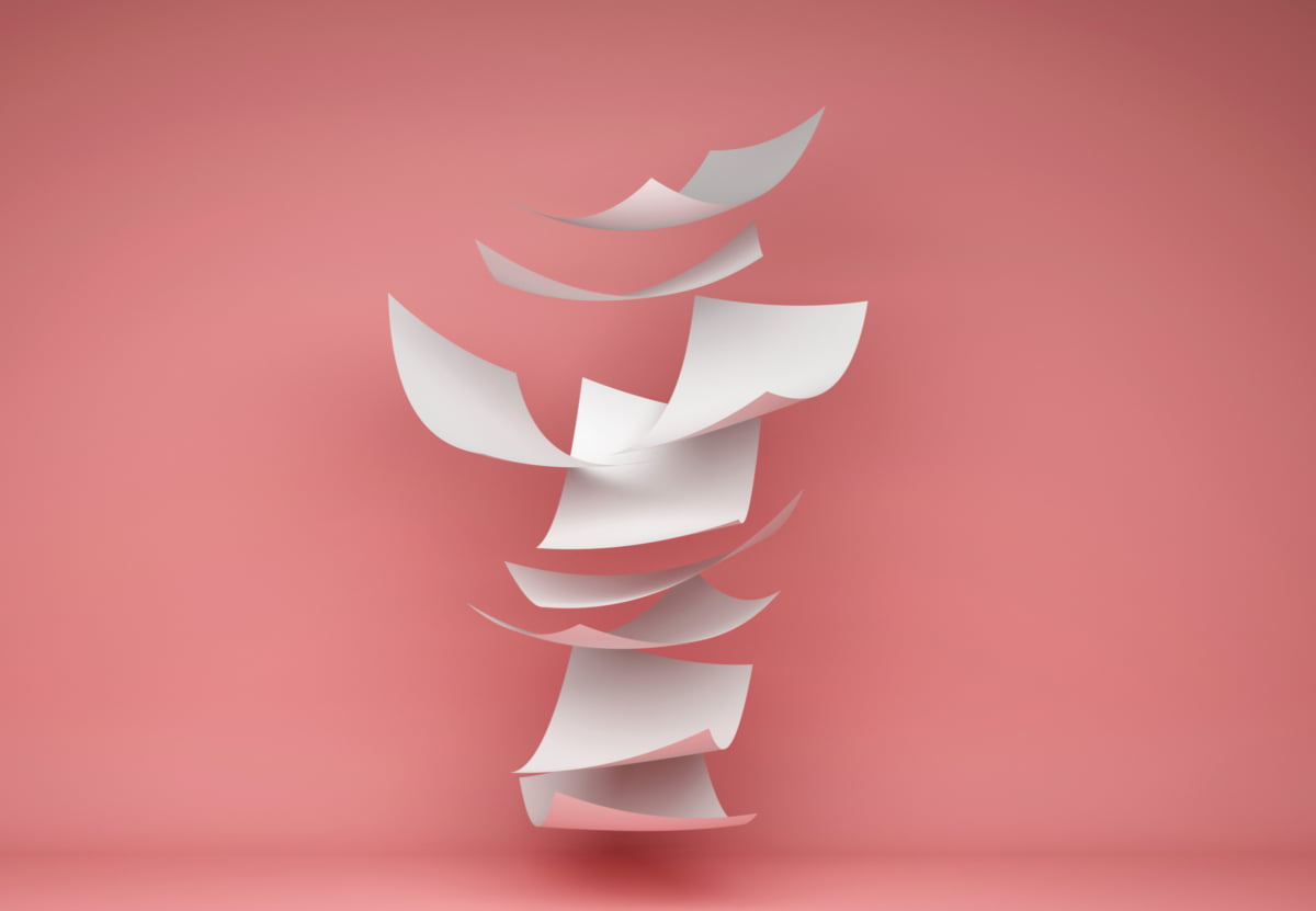 Disorganized papers falling into a single stack