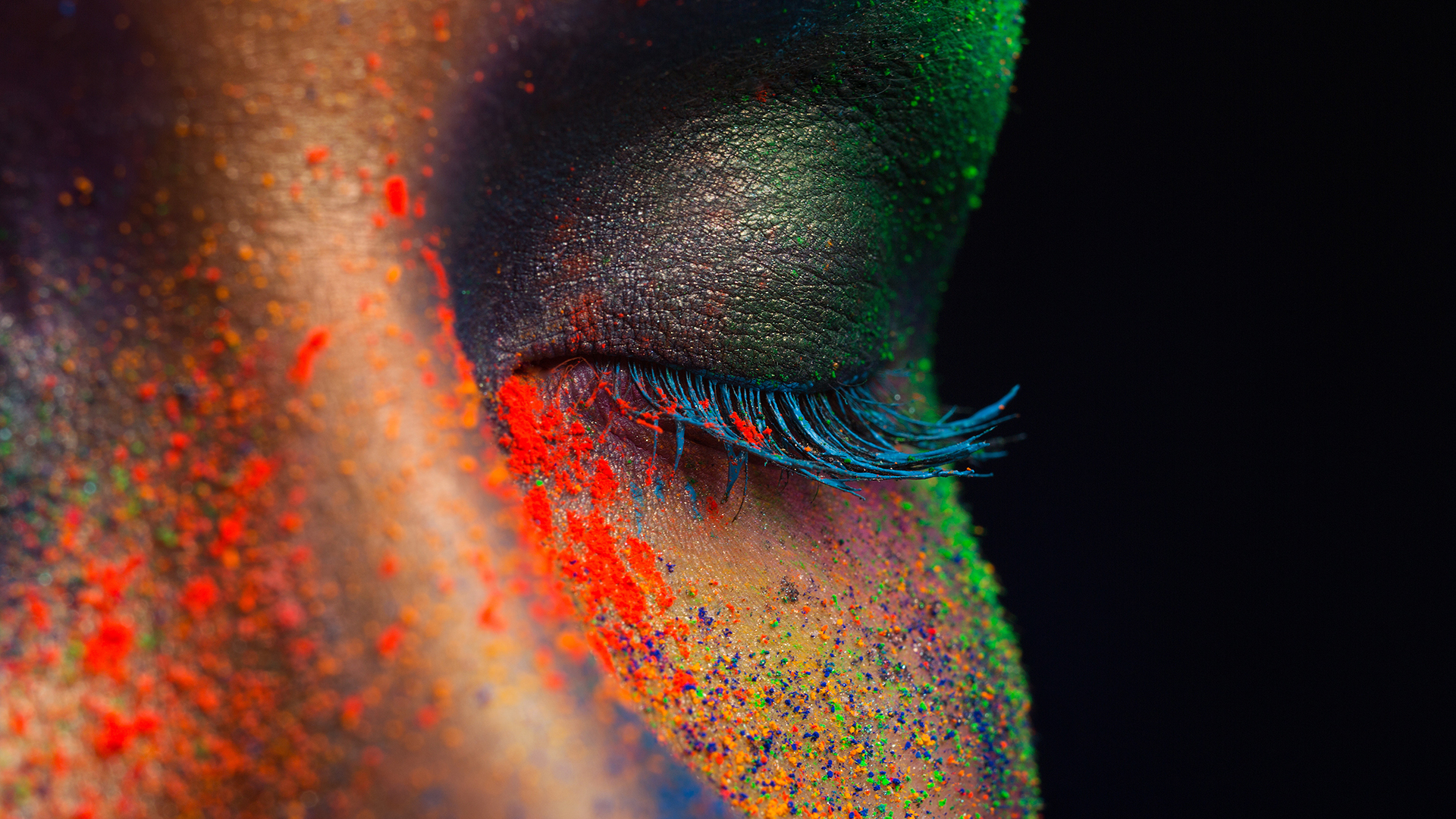 Eye of model with colorful art make-up, close-up