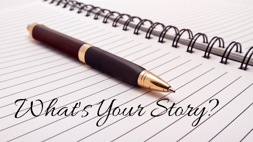 Pen sitting atop a notebook with "What's your story?" super imposed on the image.