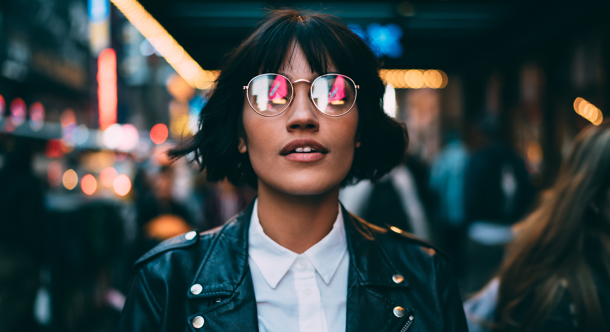 Person in optical spectacles with neon reflection