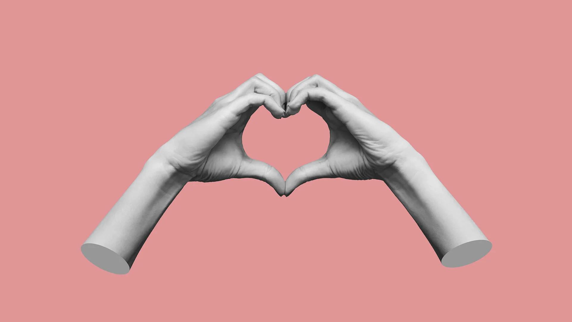 Grey hands held together to form a heart on a pink background.