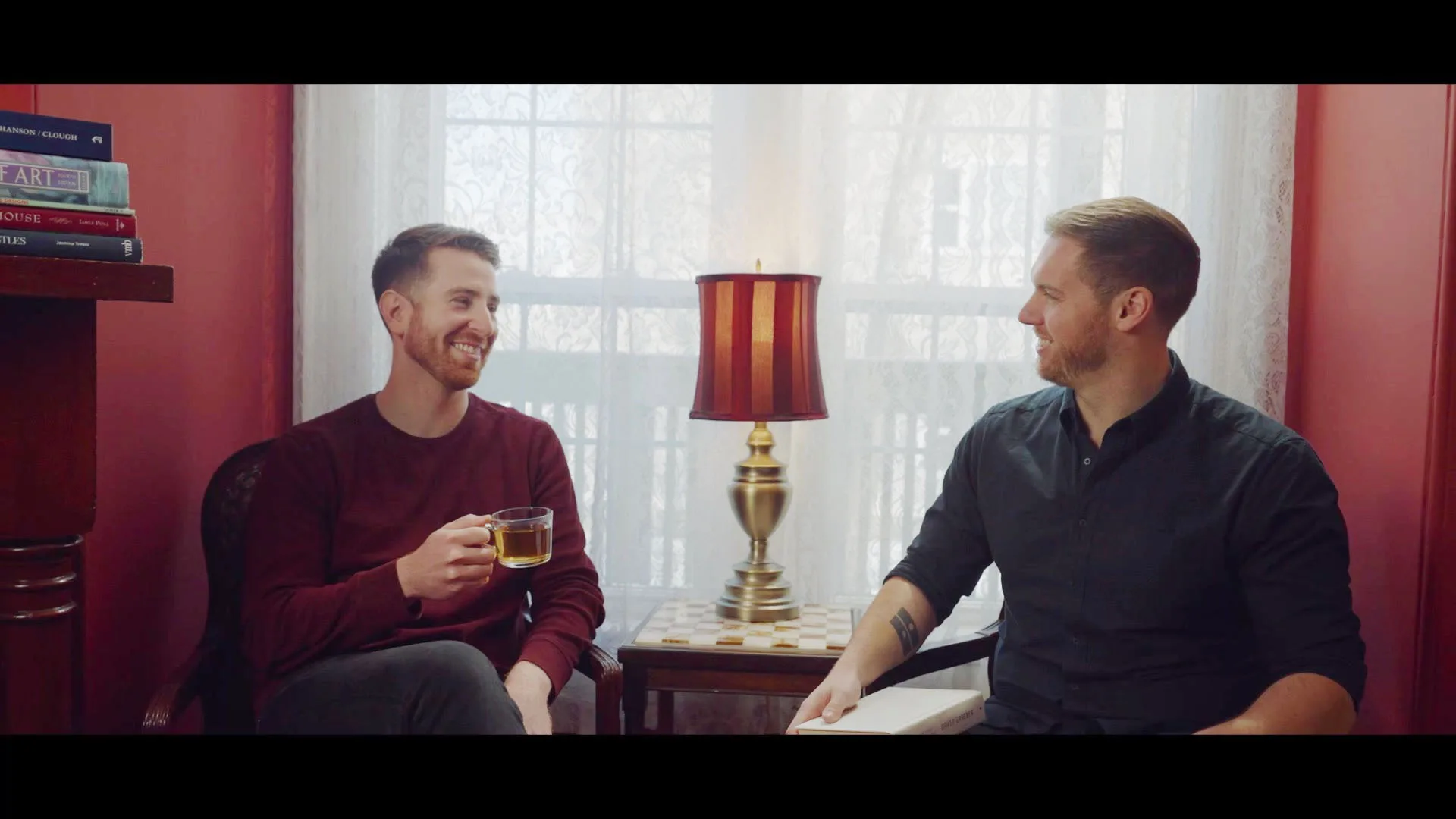 Male couple in their Bed and Breakfast sitting room.