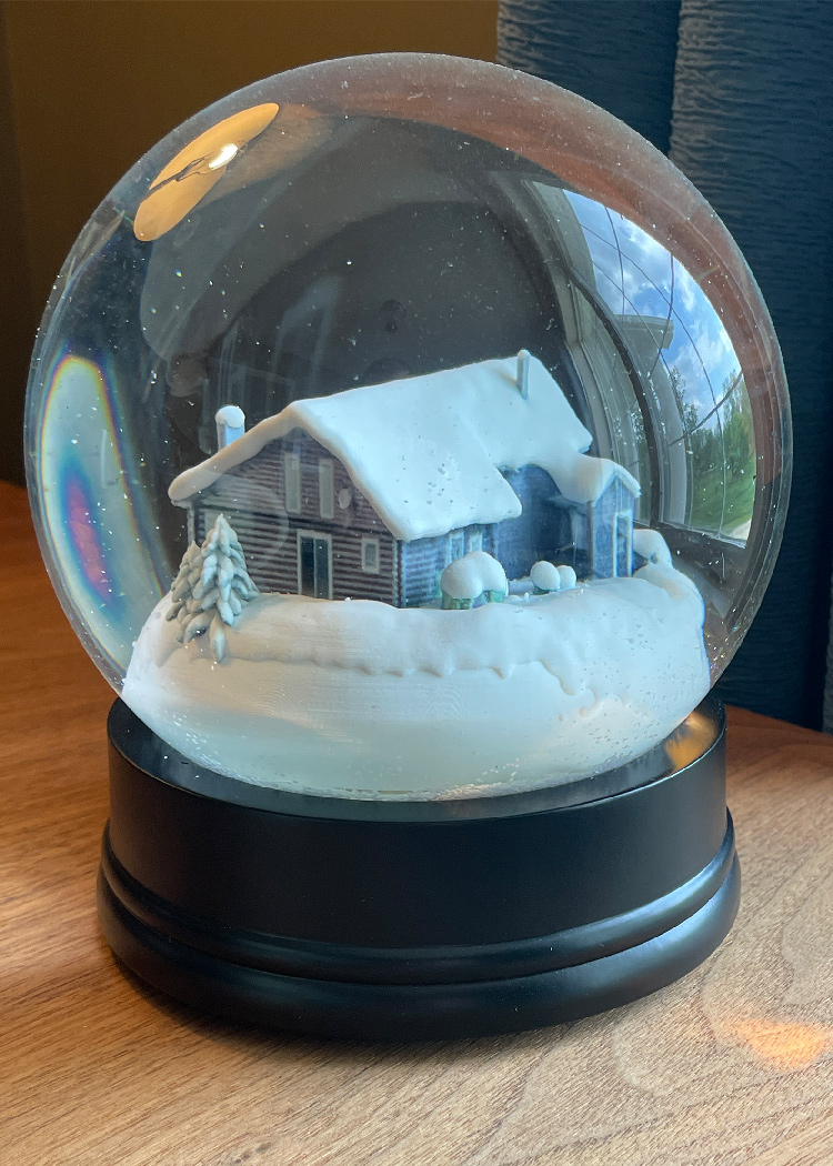 Snow globe of small house