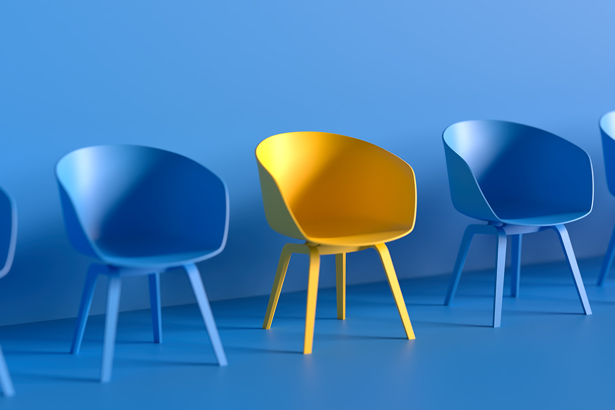 Yellow Chair Among Blue Chairs