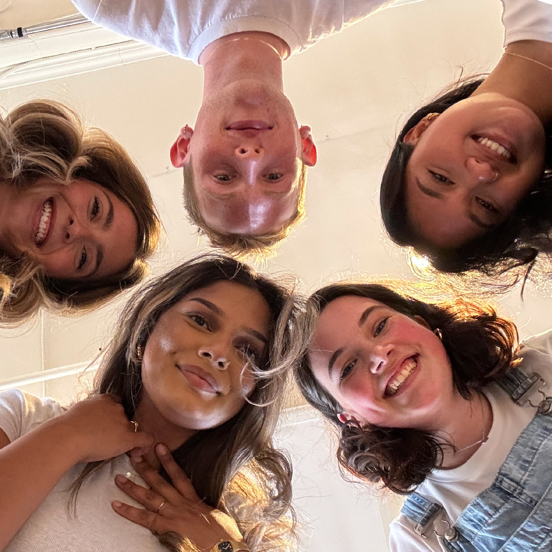 Our interns looking down at the camera lens from above.